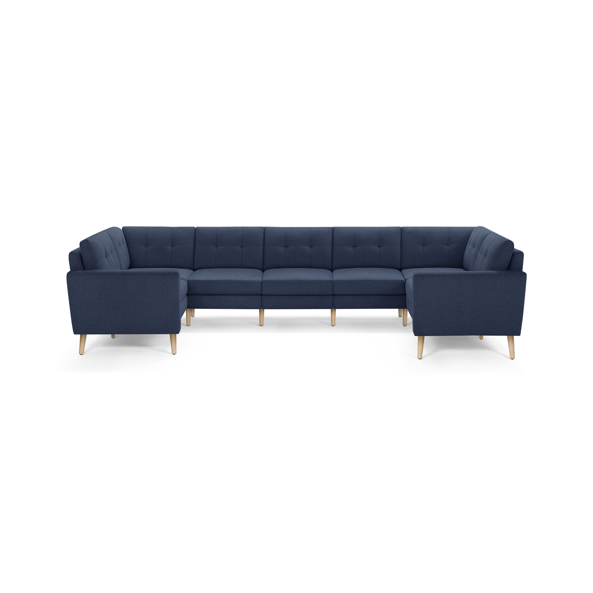 Large U-shaped sectional sofa in navy blue fabric with tufted cushions and light wooden legs, modern design.