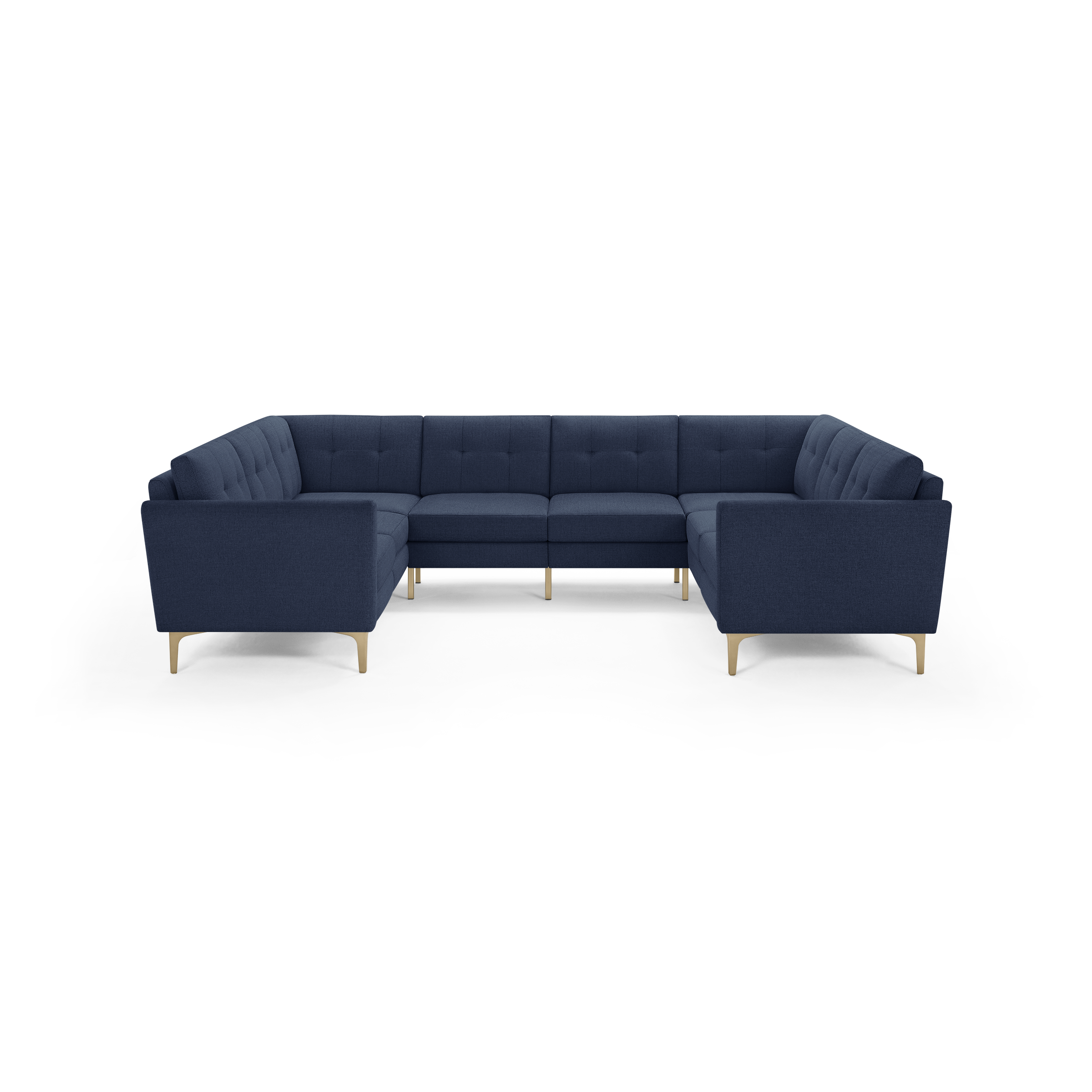 Large navy blue sectional sofa with tufted back cushions and light wooden legs, shown against a black background.