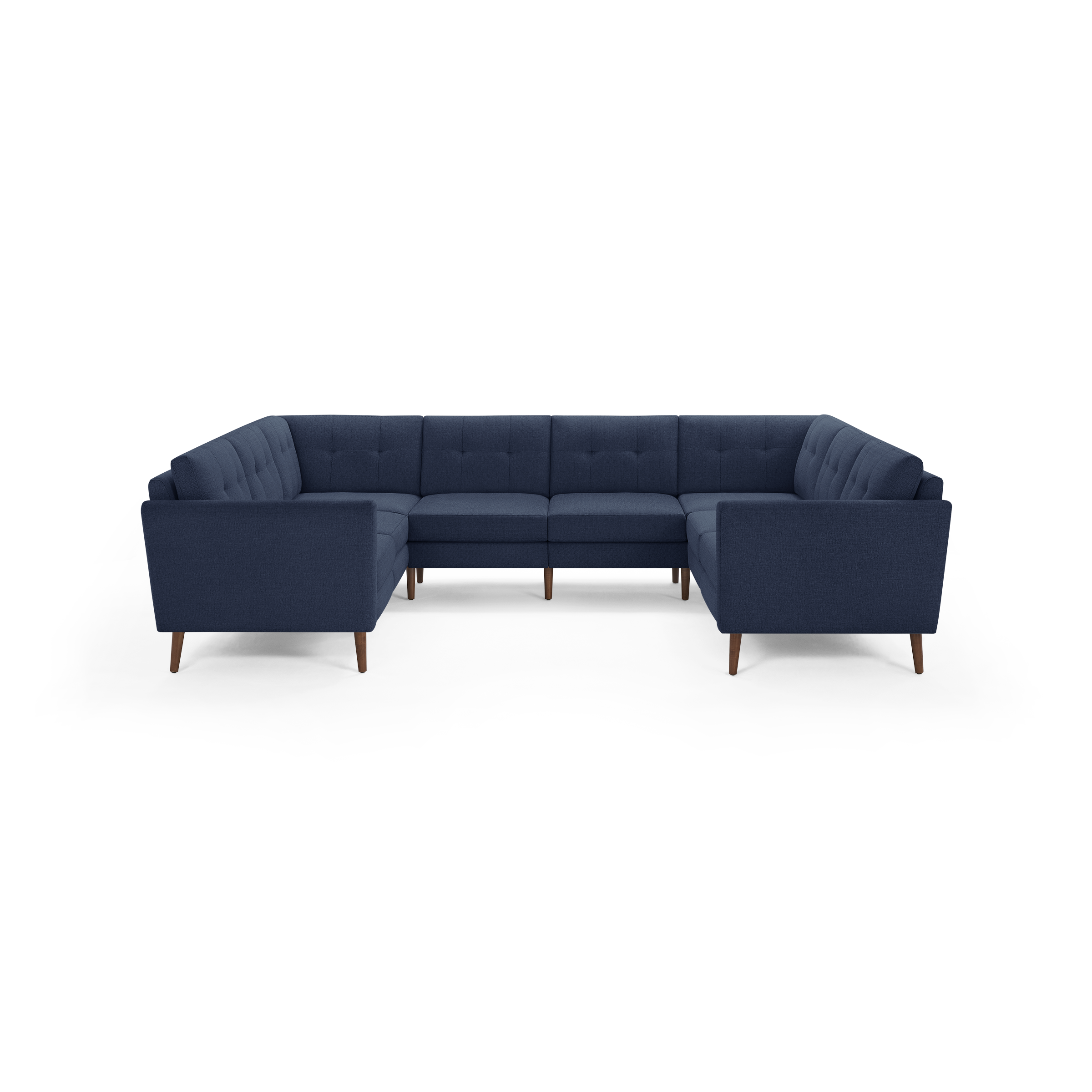 Large U-shaped sectional sofa upholstered in navy blue fabric with tufted cushions and wooden legs.