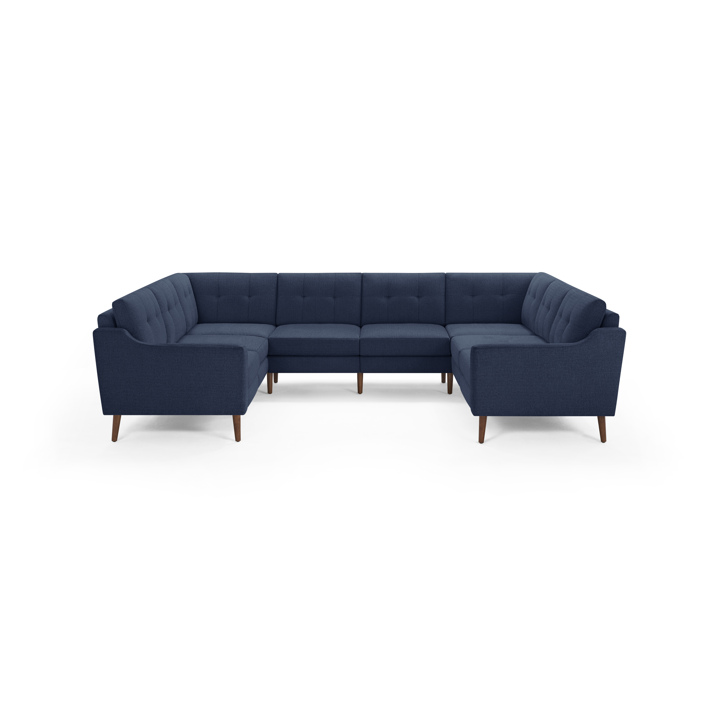 Large navy blue fabric sectional sofa with tufted back cushions and wooden tapered legs, designed in a U-shape for ample seating.
