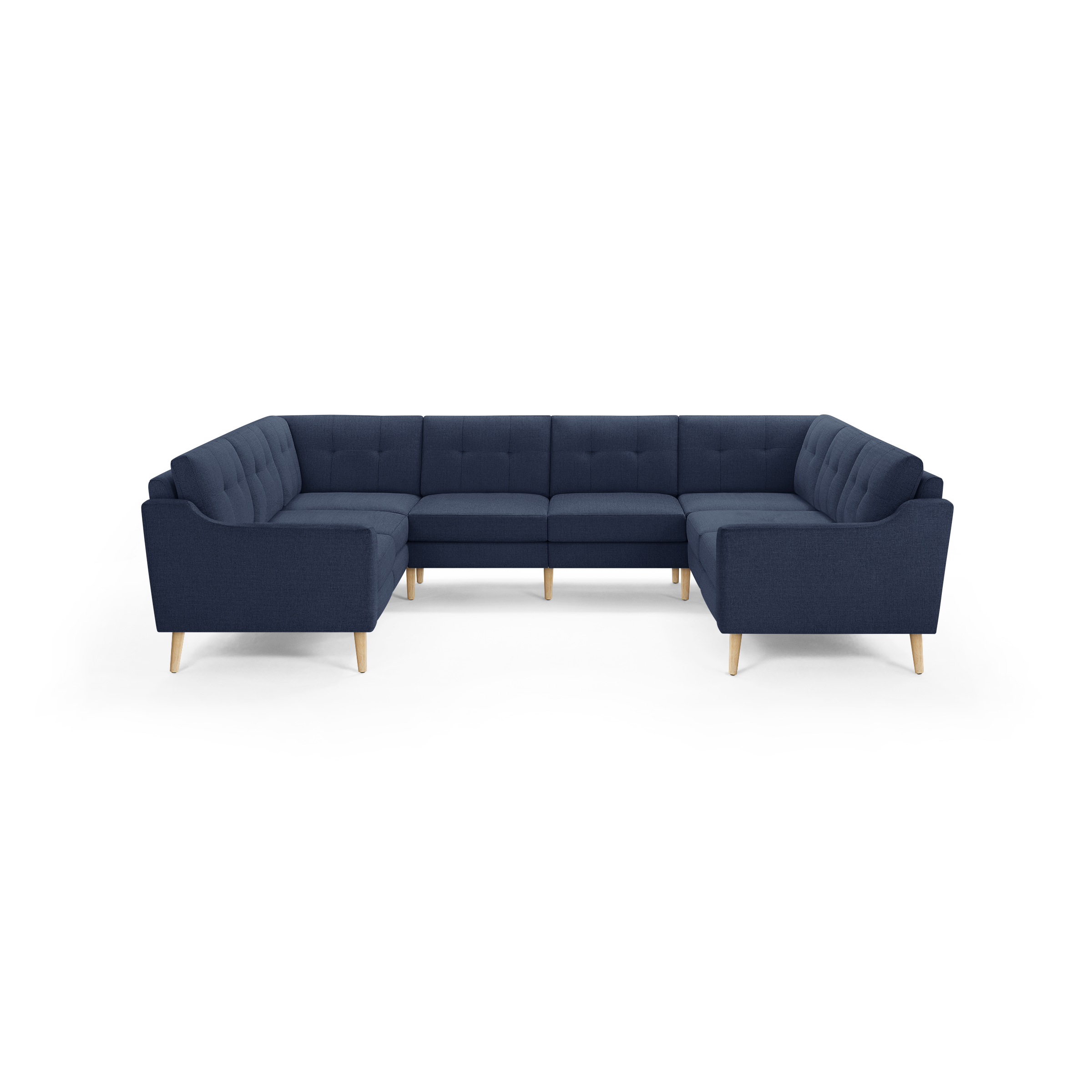 Large navy blue U-shaped sectional sofa with tufted cushions and light wooden legs, designed for spacious living rooms.
