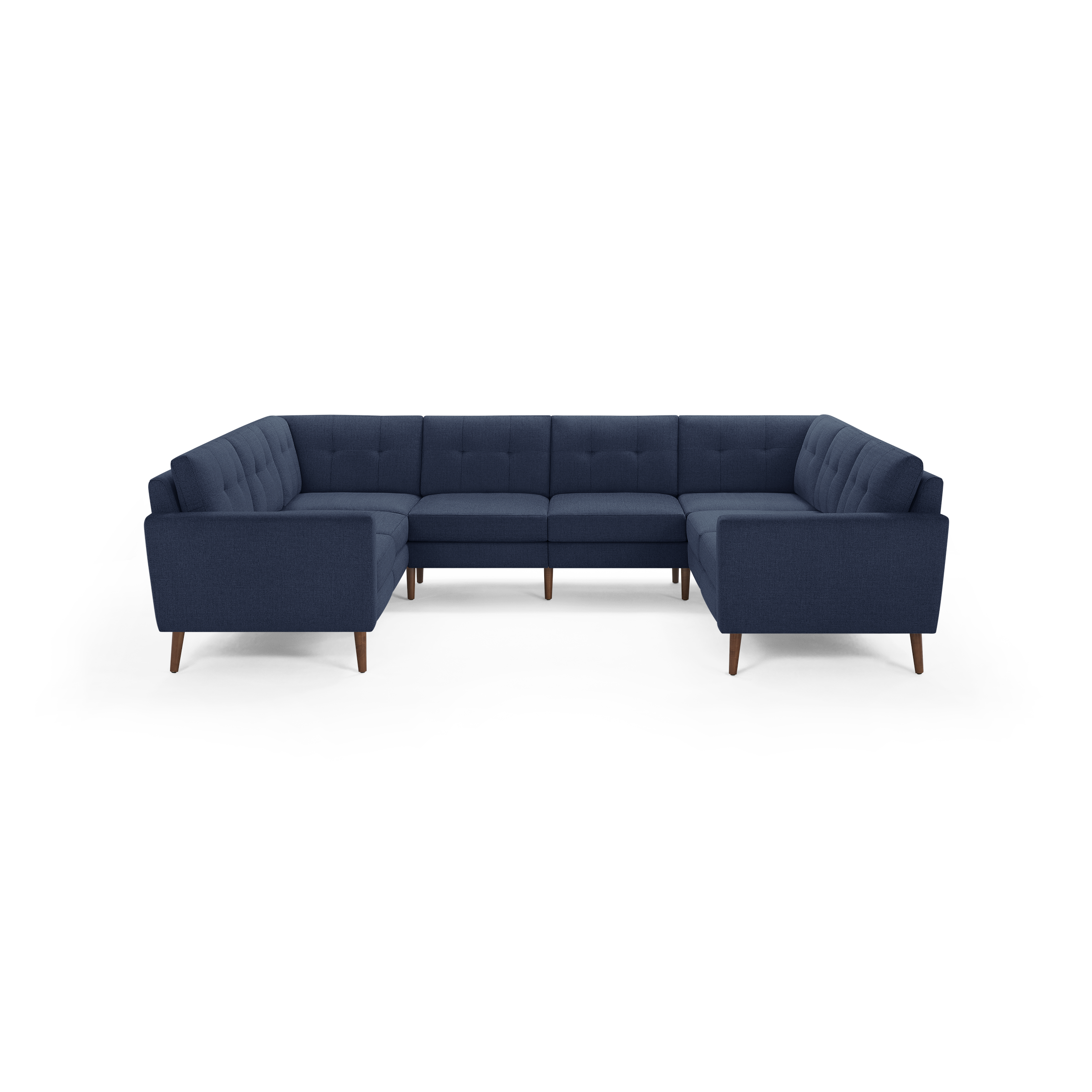 Large U-shaped sectional sofa with deep blue fabric upholstery, tufted back cushions, and wooden tapered legs.