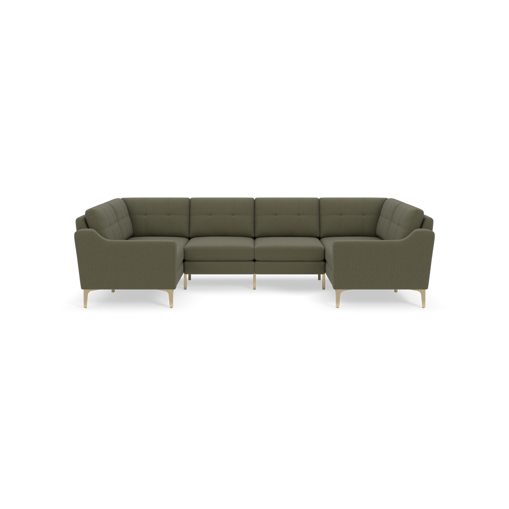 L-shaped Moss green sectional sofa with soft fabric upholstery, tufted cushions, and light wooden legs, shown against a black background.