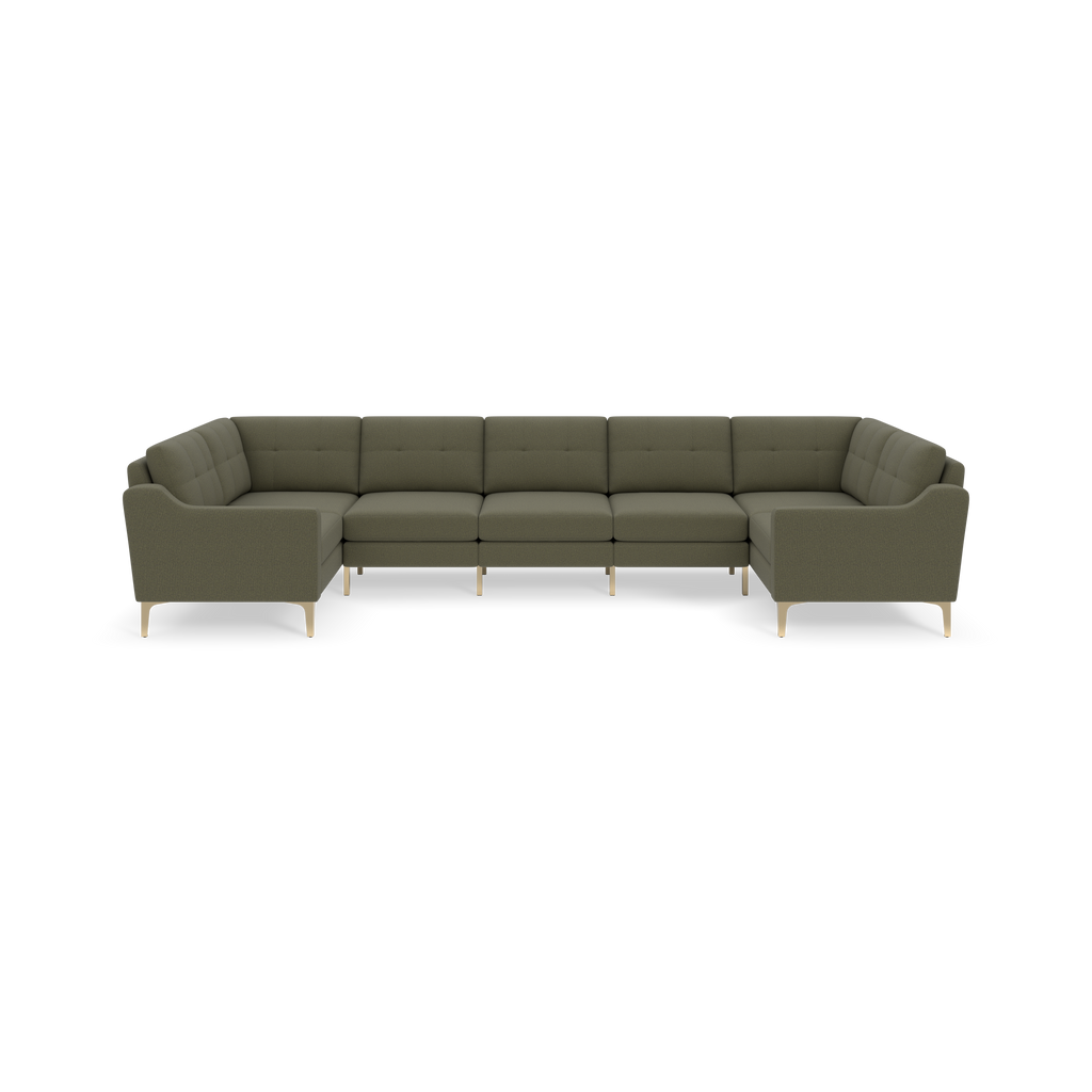 Large U-shaped sectional sofa in muted Moss green fabric with tufted cushions and light wooden legs on black background.