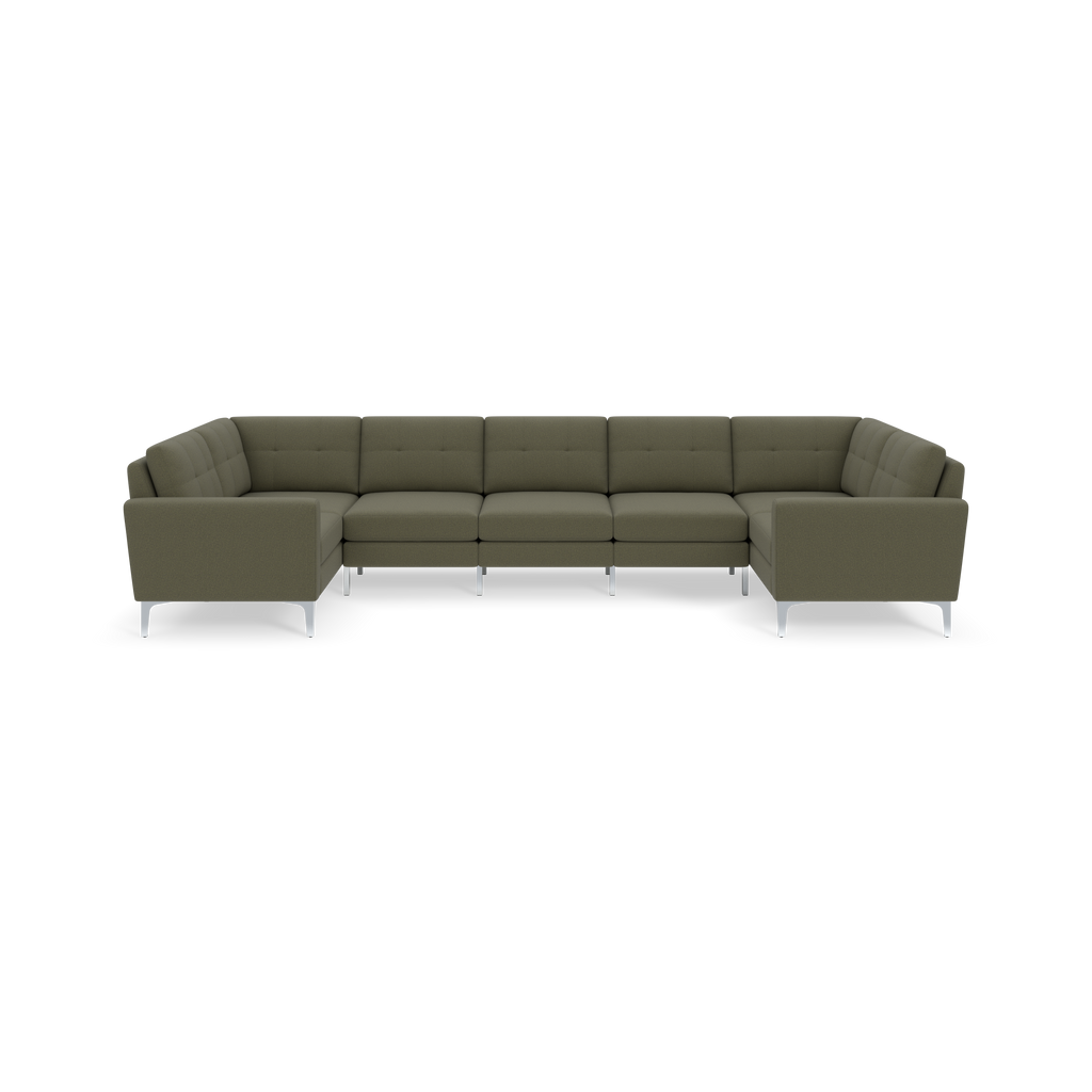 Large Moss green U-shaped sectional sofa with tufted cushions and sleek metal legs on a black background.