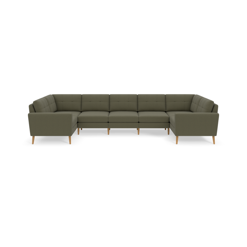 Large U-shaped sectional sofa with Moss green fabric upholstery and wooden legs, featuring tufted back cushions and armrests.