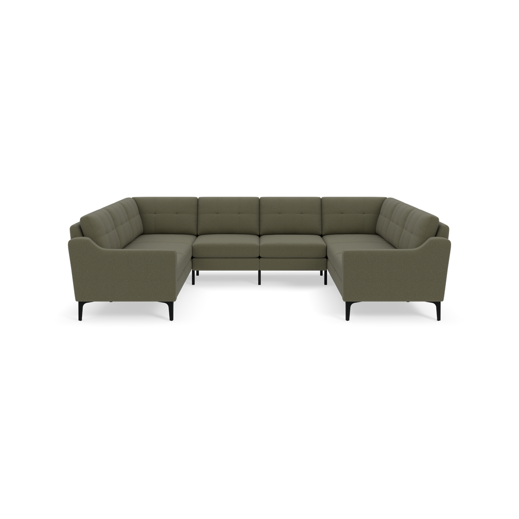 Large Moss green sectional sofa with tufted back cushions, modern curved armrests, and black legs, shown against a black background.