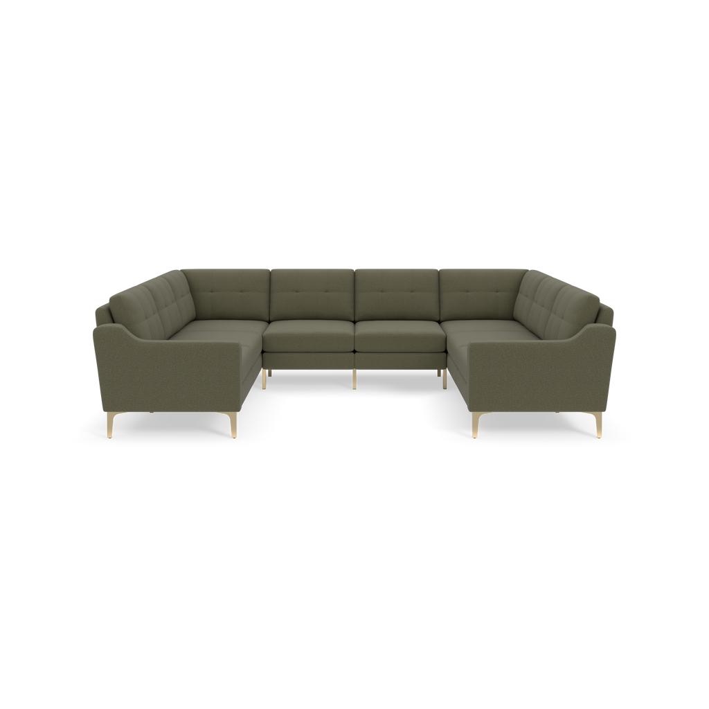 Moss green sectional sofa with tufted back cushions, curved armrests, and light wooden legs, arranged in a U-shape.