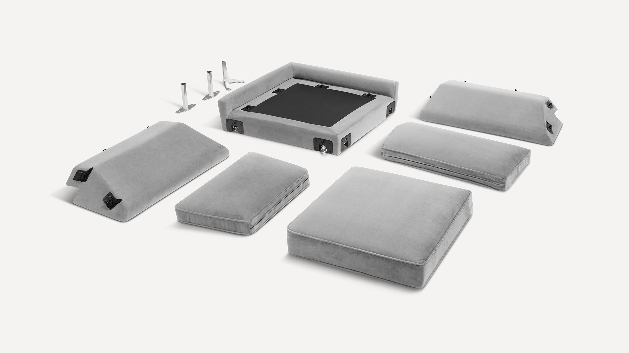 Disassembled modern gray sectional sofa with cushioned seats, backrests, armrests, and metal support legs on a white background.