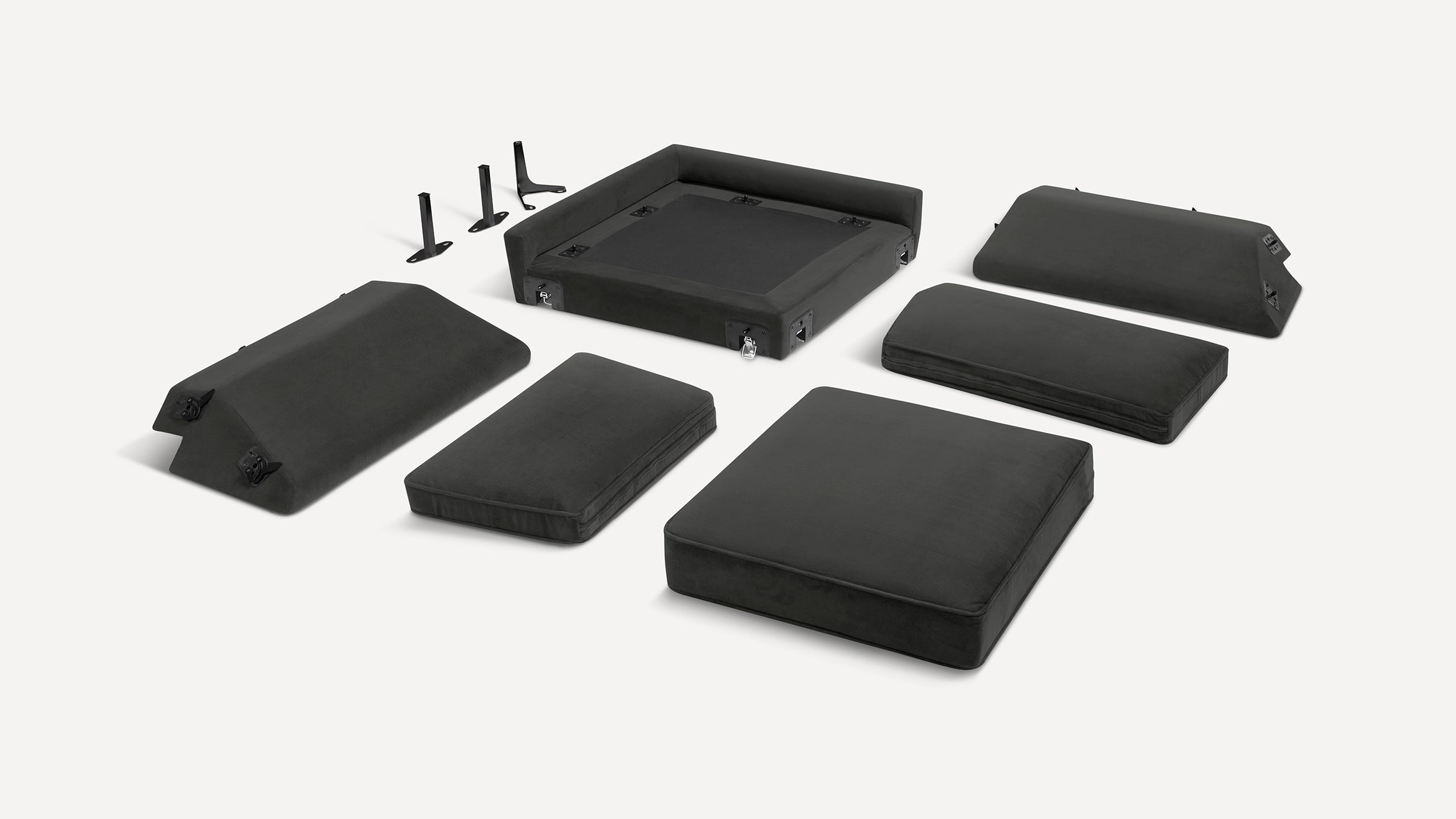 Black modular sofa cushions and components, including seat, backrest, armrests, and metal brackets, laid out on a white background.