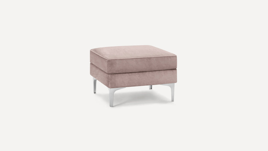 Square mauve velvet ottoman with plush cushion and four sleek silver legs on a plain white background.