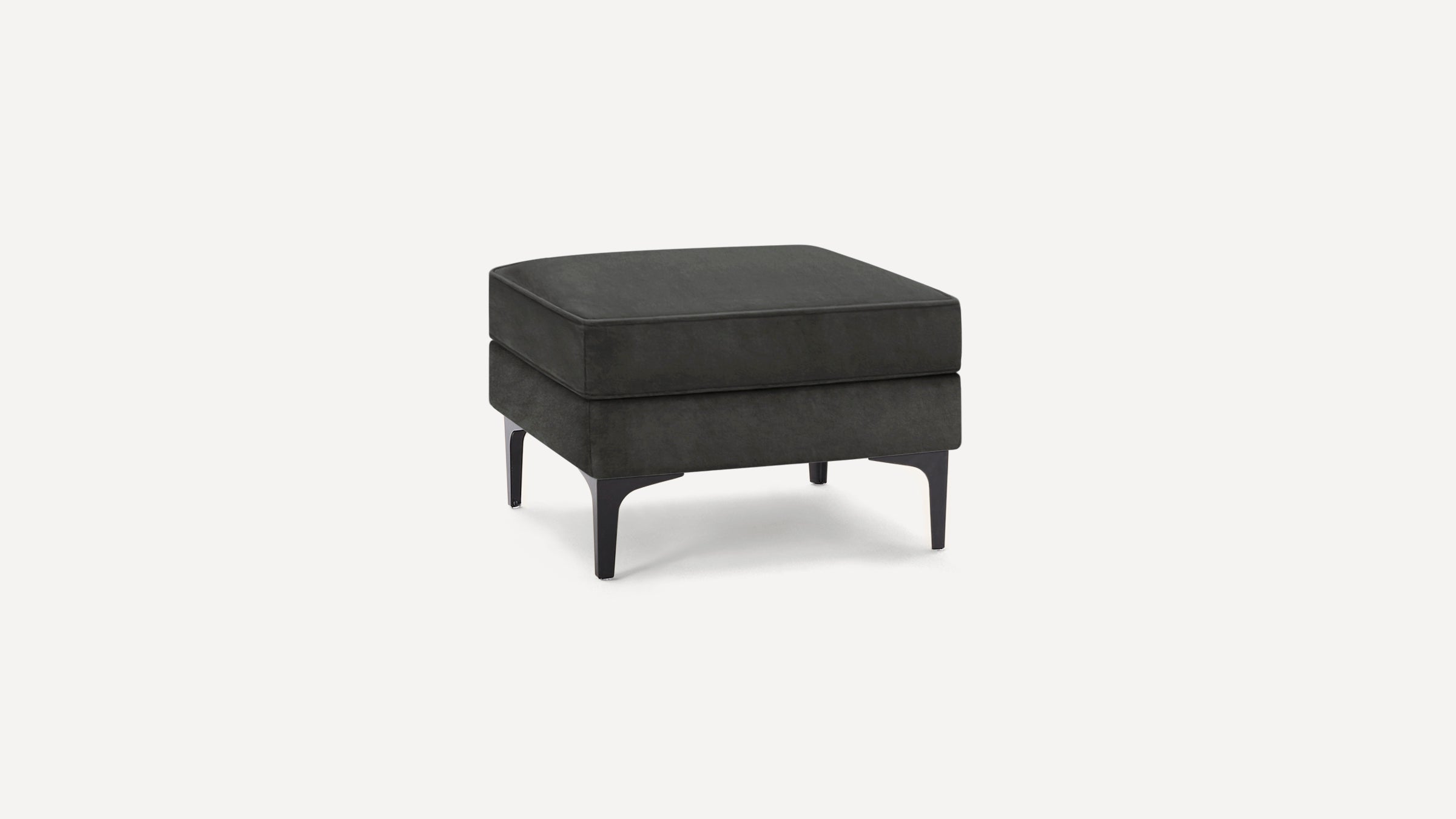 Square black upholstered ottoman with black metal legs, featuring a cushioned top and modern minimalist design.