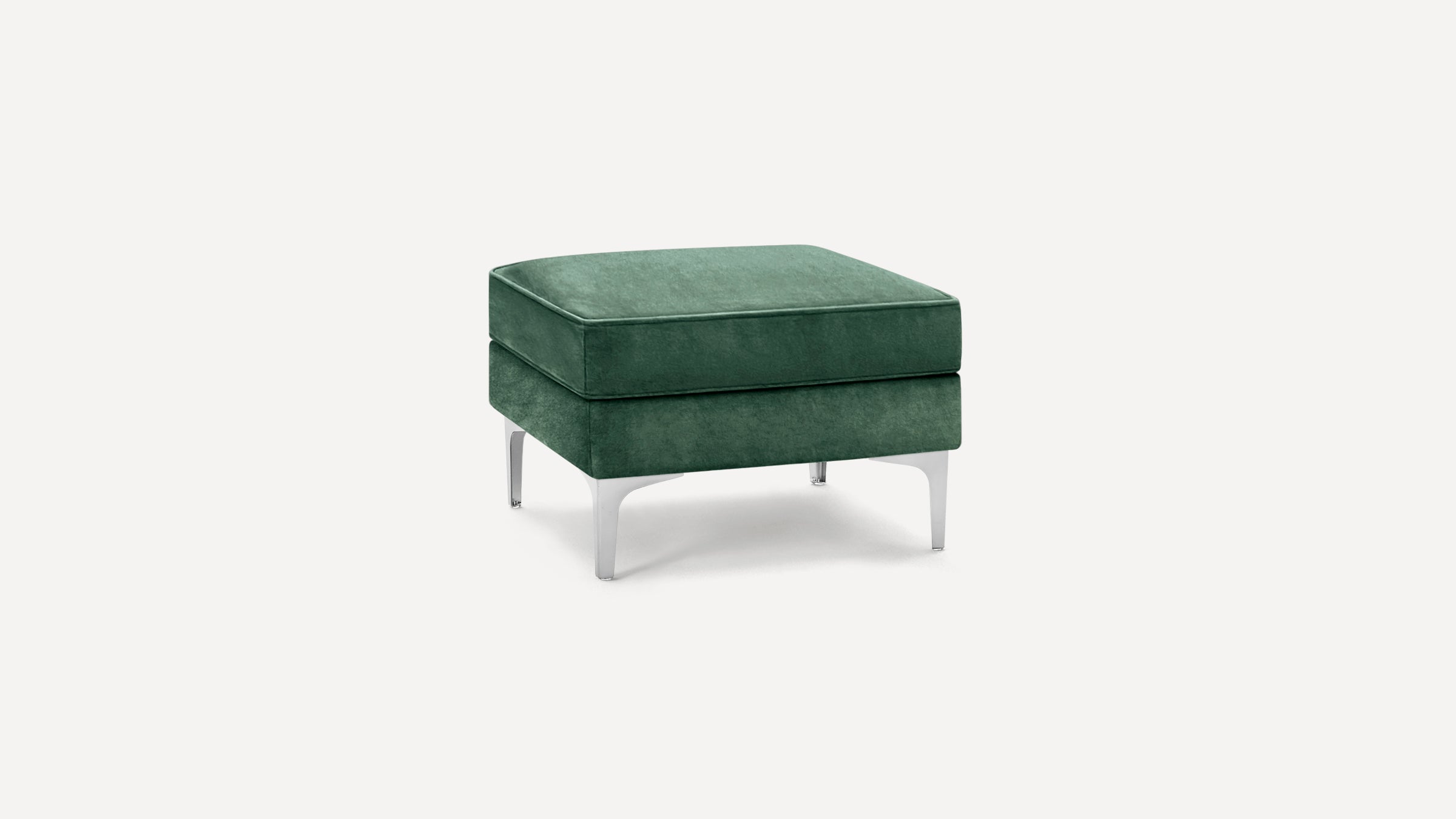 Square green velvet ottoman with sleek silver metal legs, featuring a cushioned top and modern design.