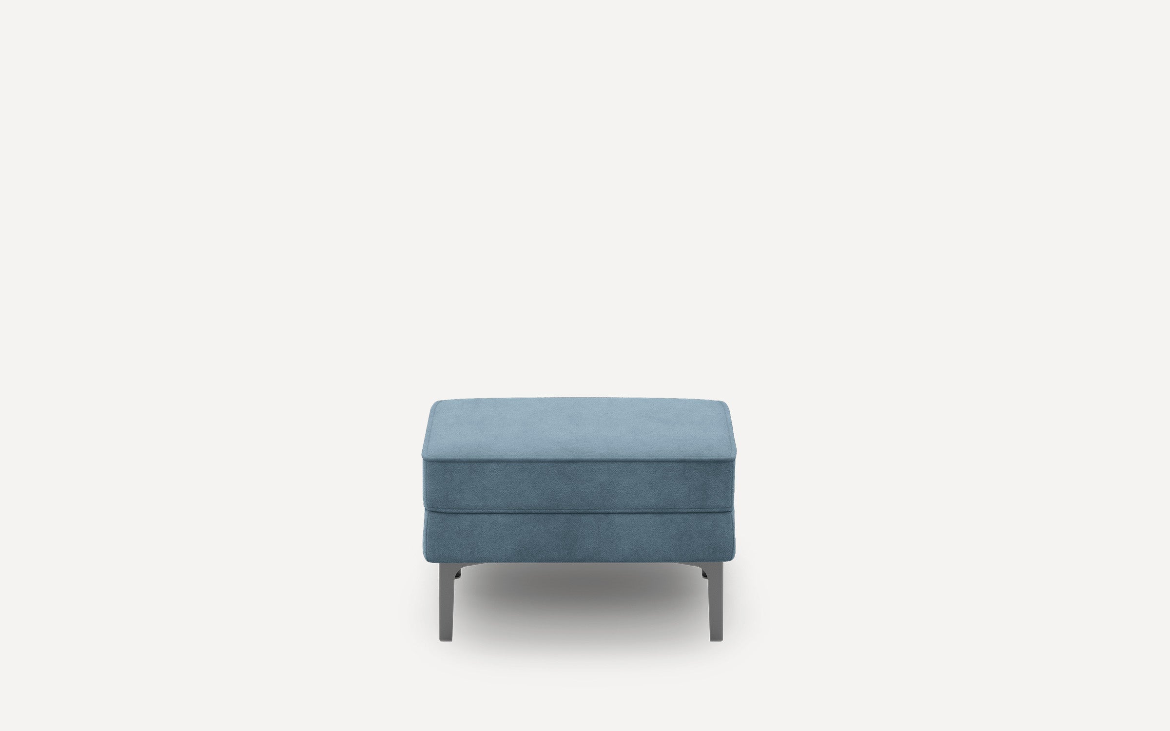 Blue upholstered rectangular ottoman with sleek metal legs on plain white background.