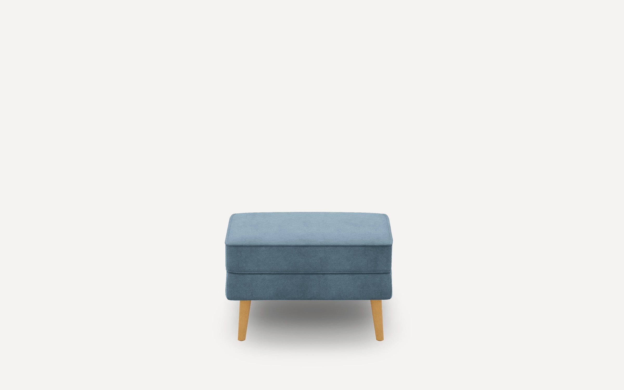 Rectangular blue upholstered ottoman with wooden legs, minimalist design, and smooth fabric surface.