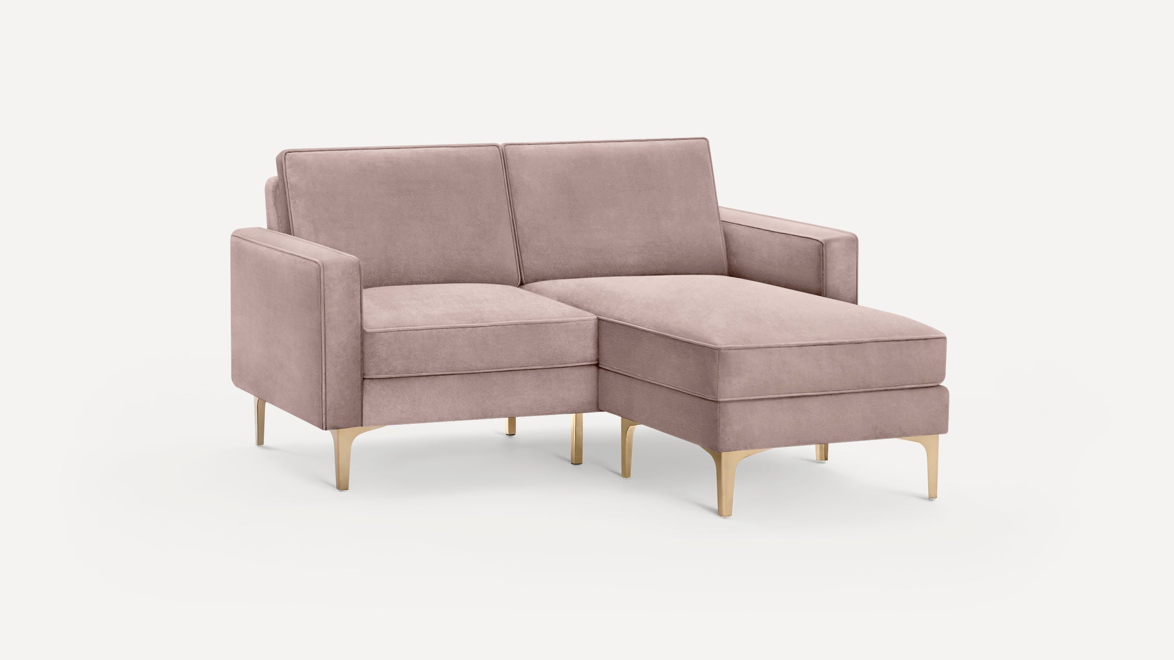 Modern mauve velvet sectional sofa with gold metal legs, featuring a chaise lounge on the right side and clean-lined armrests.
