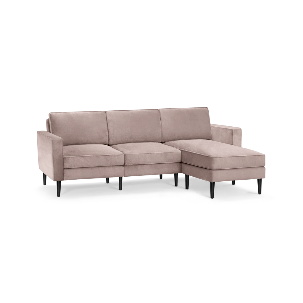 modern l - shaped sectional sofa with sleek black legs and a deep tau beige fabric upholstery, featuring a sleek backrest and sleek