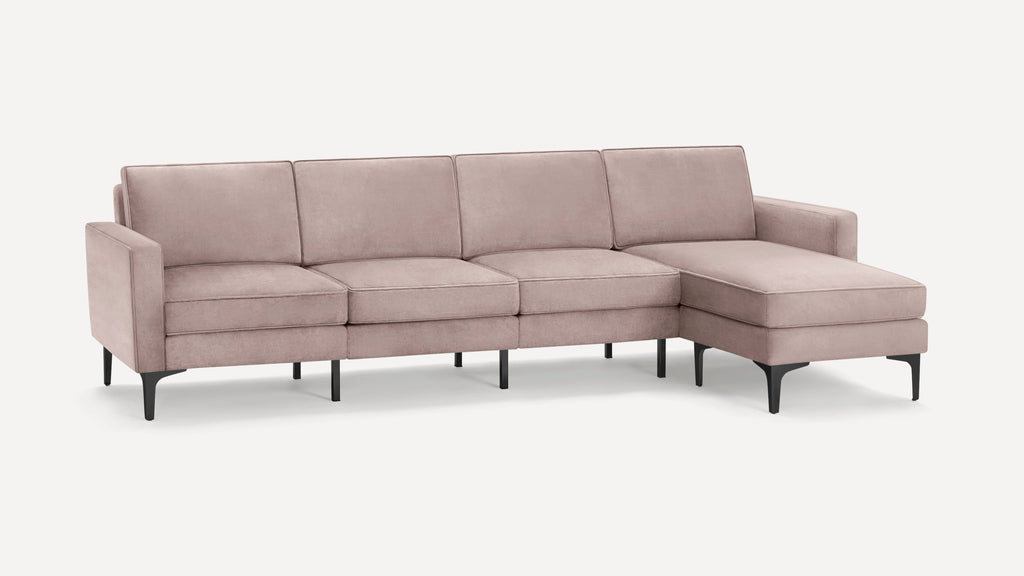 Modern light pink velvet sectional sofa with clean lines, metal legs, and right-side chaise lounge on a white background.
