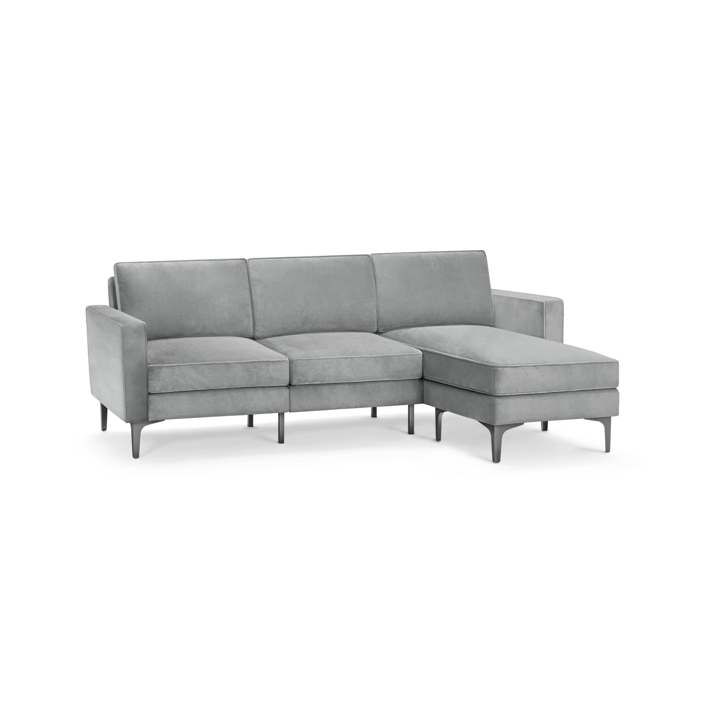 modern l - shaped sectional sofa with tufted back cushions and tapered legs in light gray fabric, featuring a sleek design and sleek lines