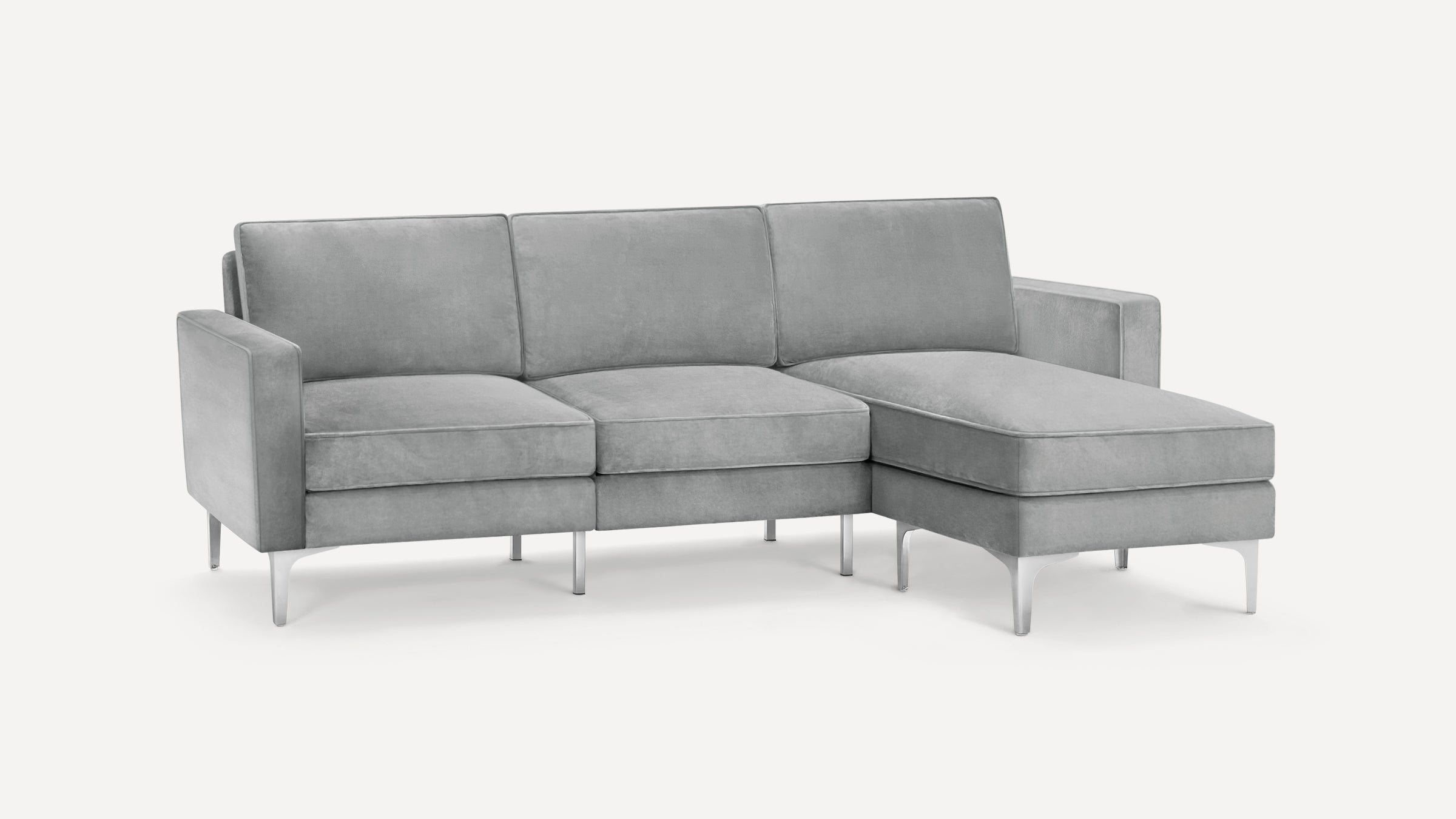 Modern light gray fabric sectional sofa with metal legs, featuring a right-side chaise lounge and clean, squared design.