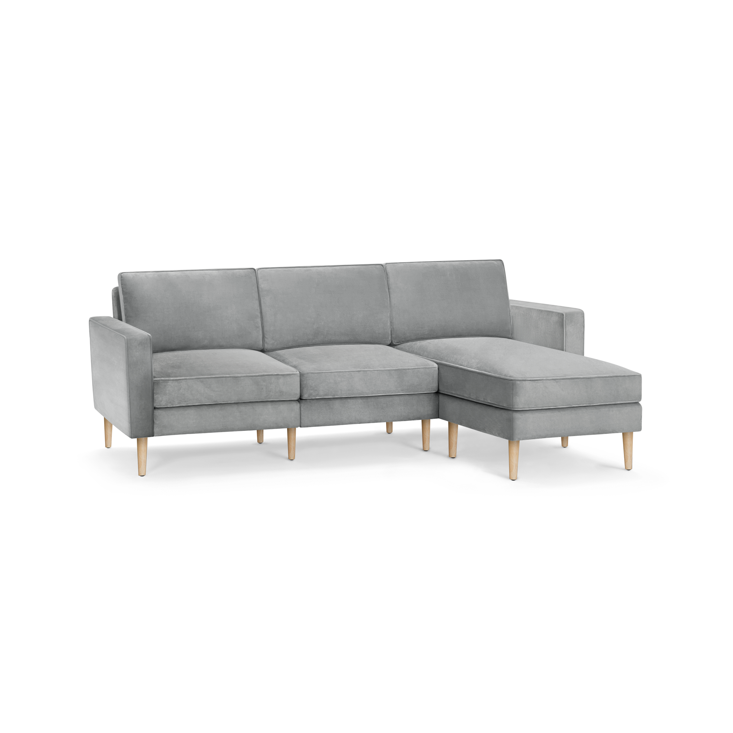 modern l - shaped sectional sofa with light gray fabric upholstery, tapered wooden legs, and clean lines on the backrests