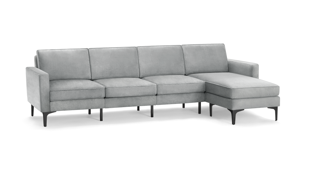 modern light gray fabric sectional sofa with chaise lounge and matching ottoman, featuring sleek metal legs and a sleek design