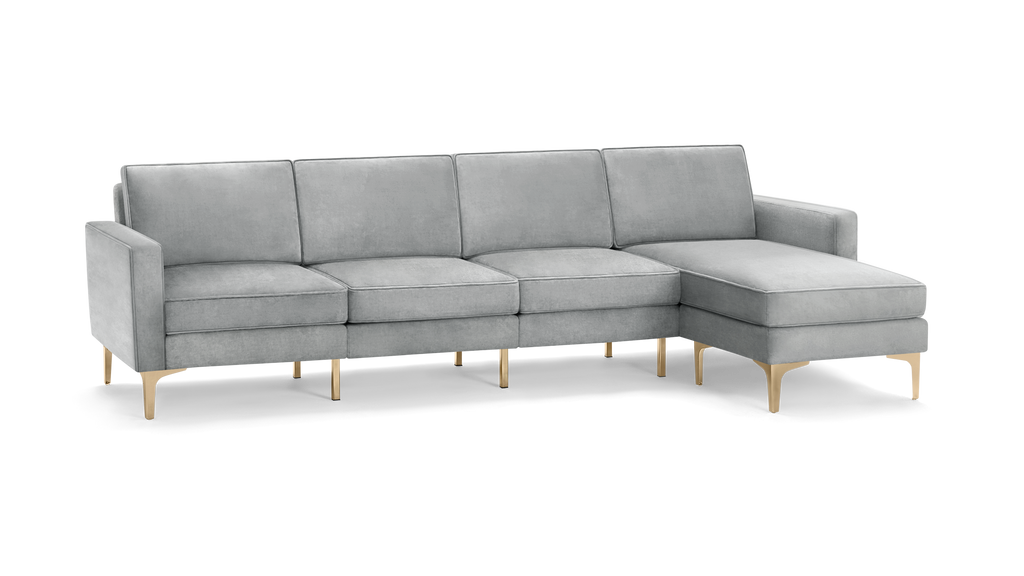 modern light gray fabric sectional sofa with matching ottoman, featuring tapered backrests, and tapered wooden legs
