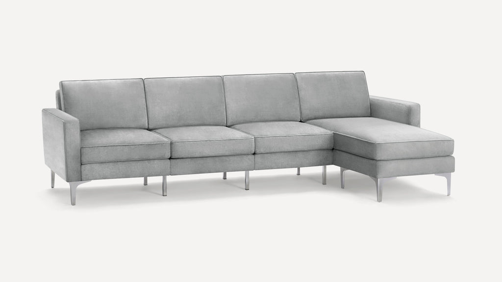 Modern light gray sectional sofa with chaise, sleek metal legs, and clean lines, perfect for contemporary living spaces.