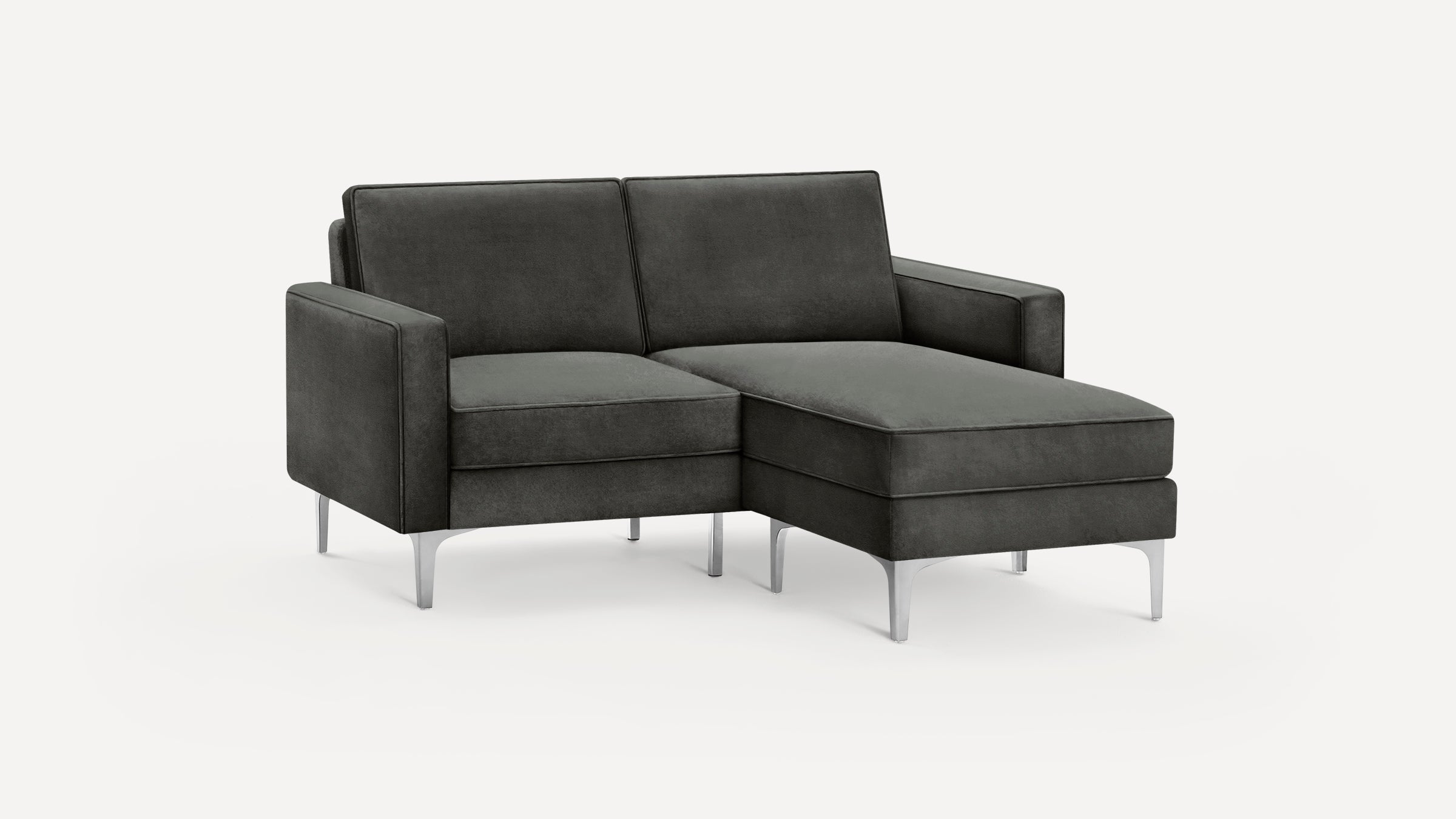 Modern dark gray velvet chaise lounge sofa with metal legs, featuring clean lines and minimalist design.