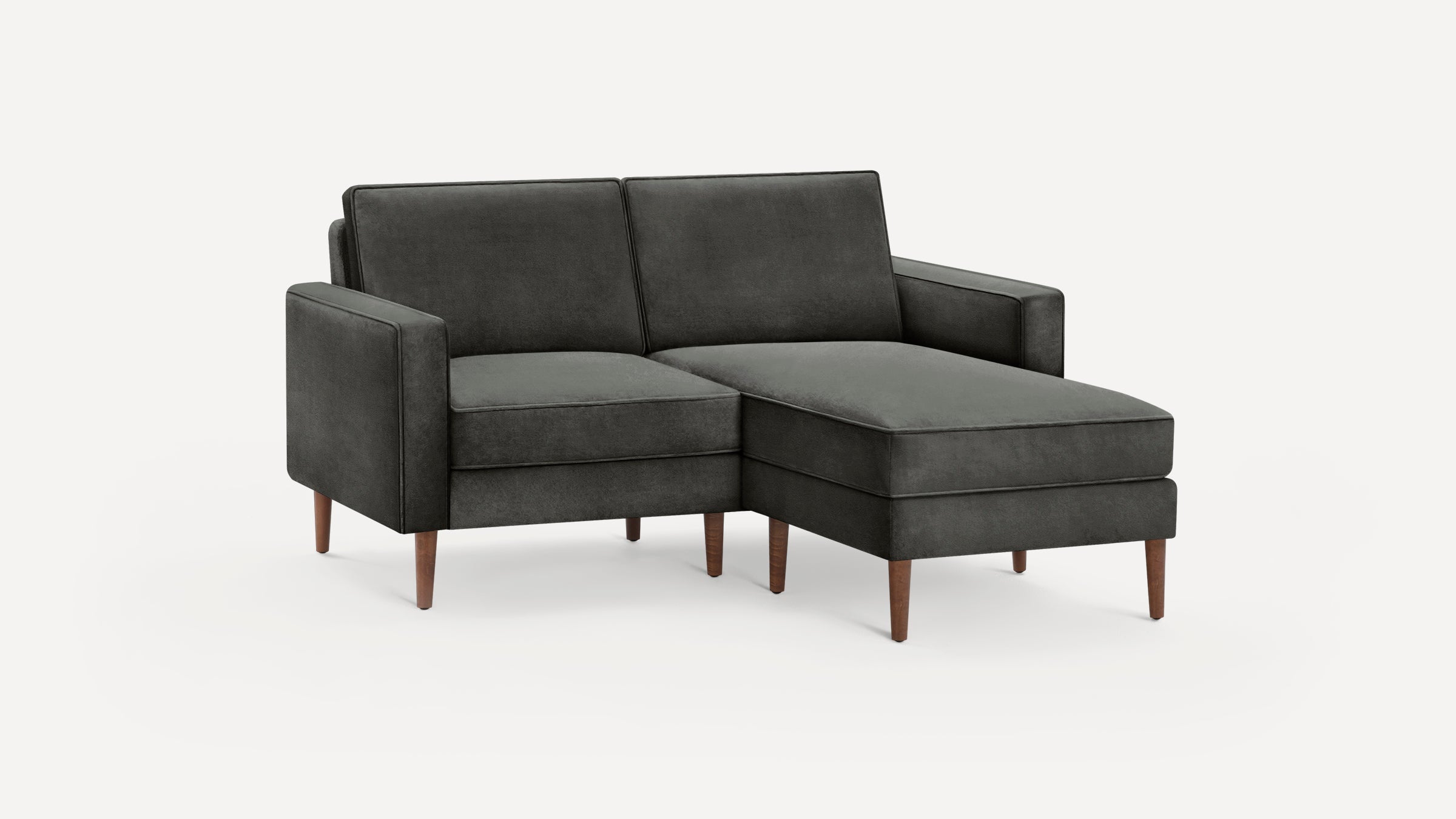 Modern dark gray upholstered sectional sofa with straight arms and wooden tapered legs on a white background.