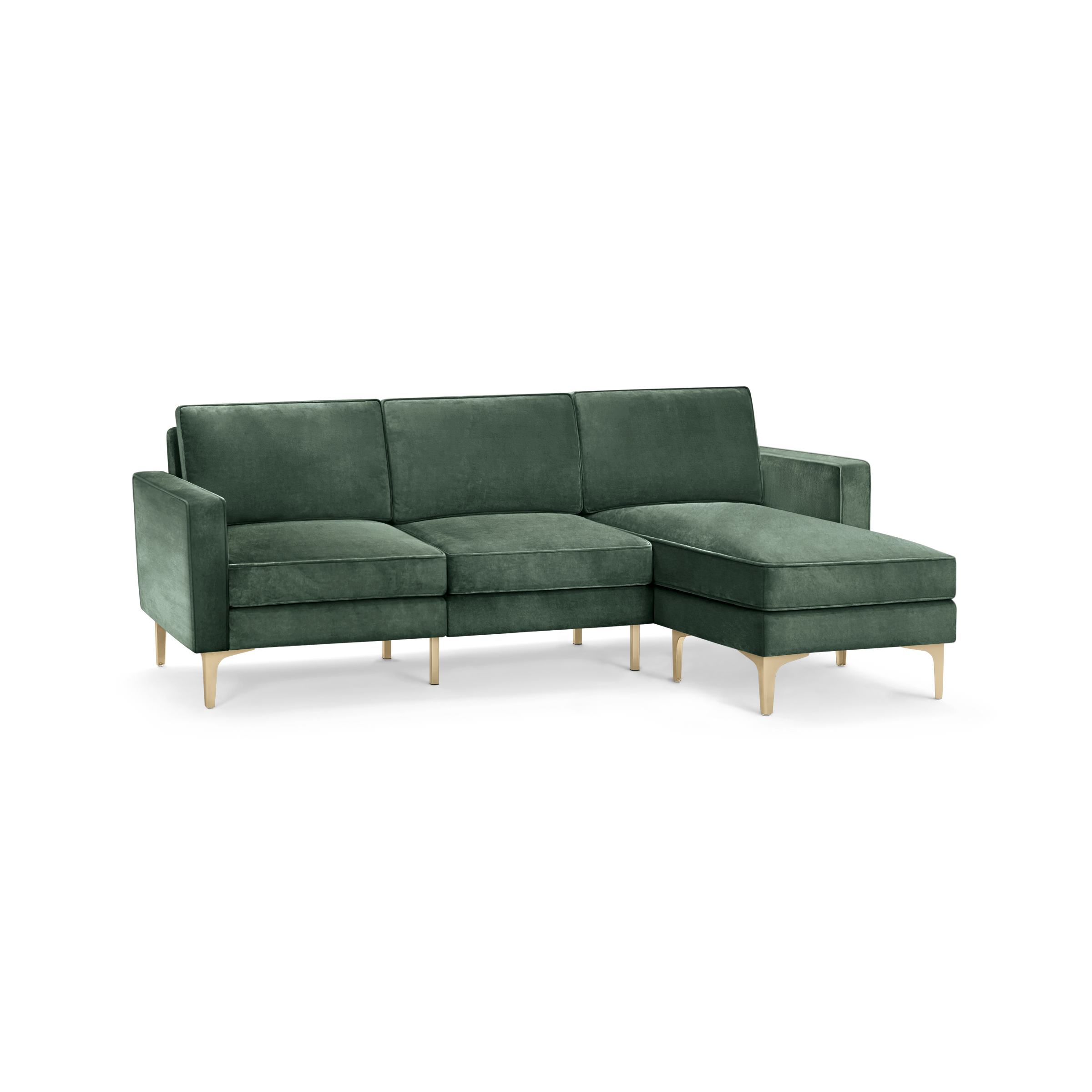 modern green velvet sectional sofa with wooden legs and clean lines on the back, featuring a chaise lounge and matching ottoman