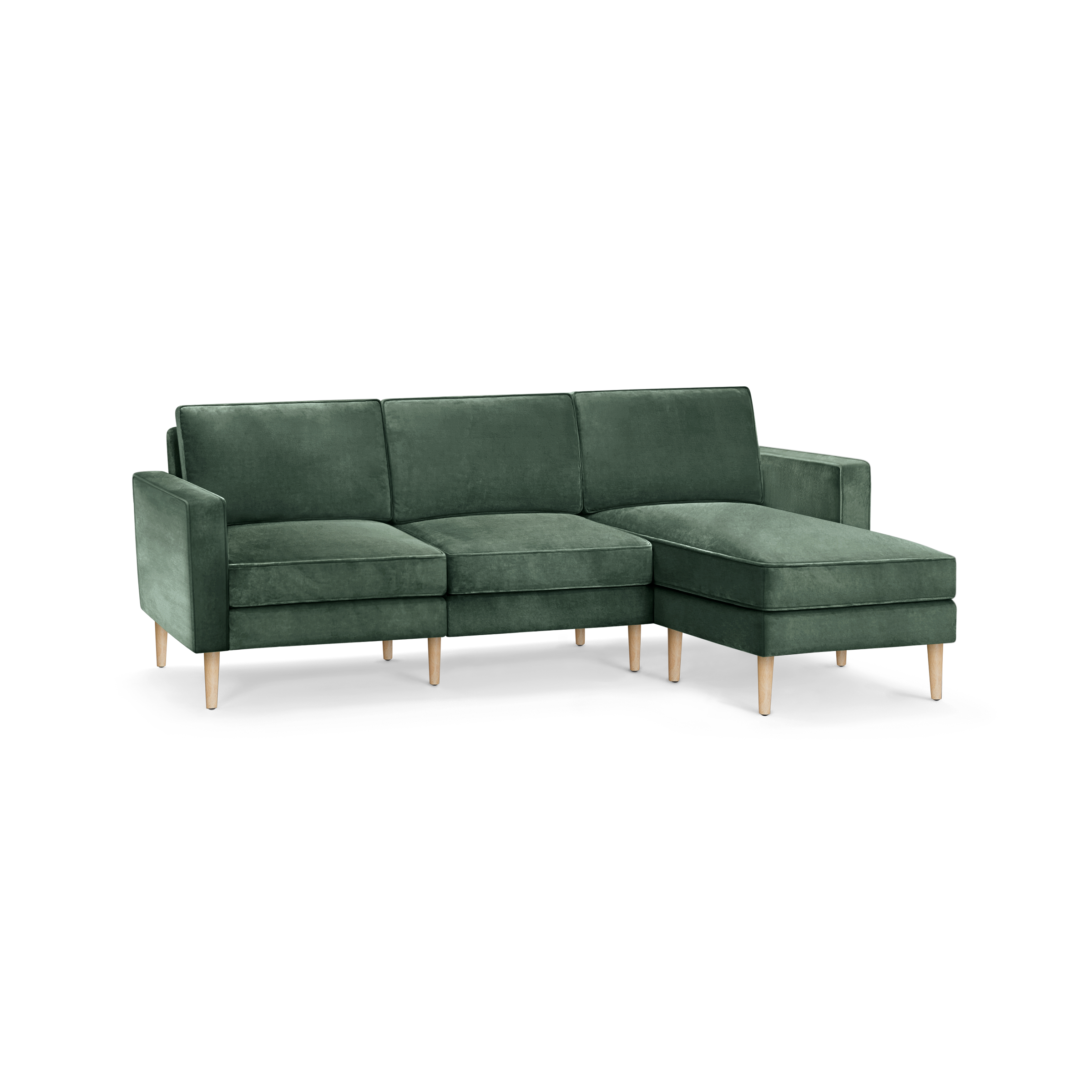 modern l - shaped sectional sofa with green velvet upholstery, tapered wooden legs, and clean lines on the back, designed for
