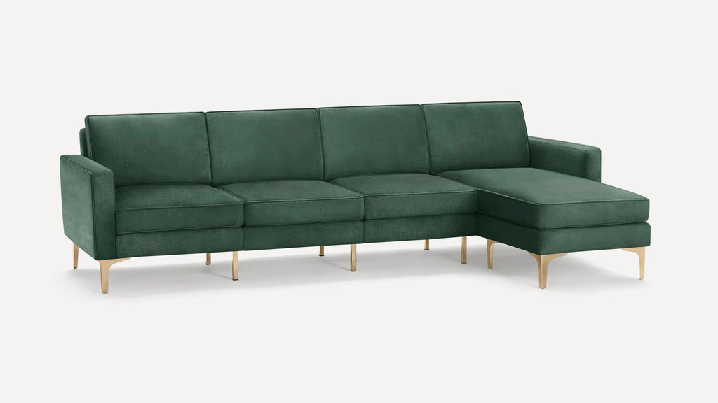 Modern green velvet sectional sofa with gold metal legs, featuring a chaise lounge on the right side.