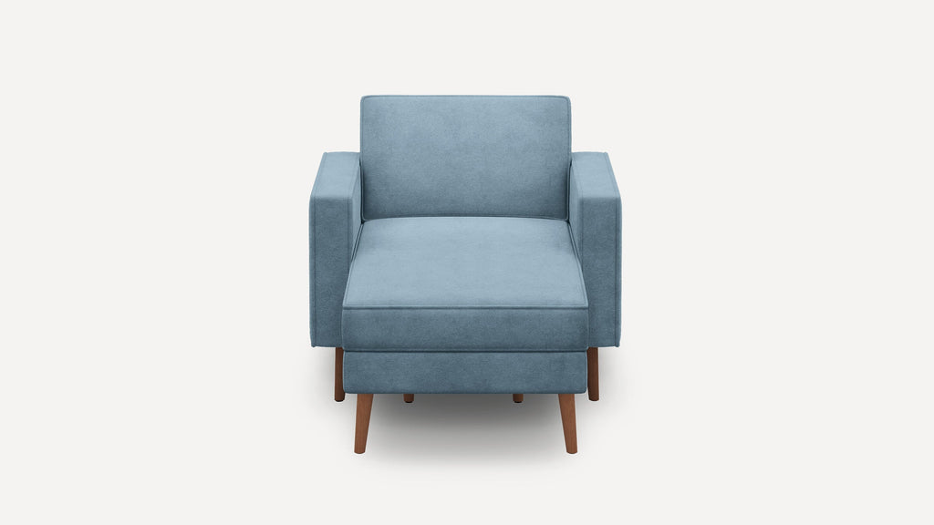 Front view of a modern, blue upholstered armchair with wooden legs and clean, simple lines.