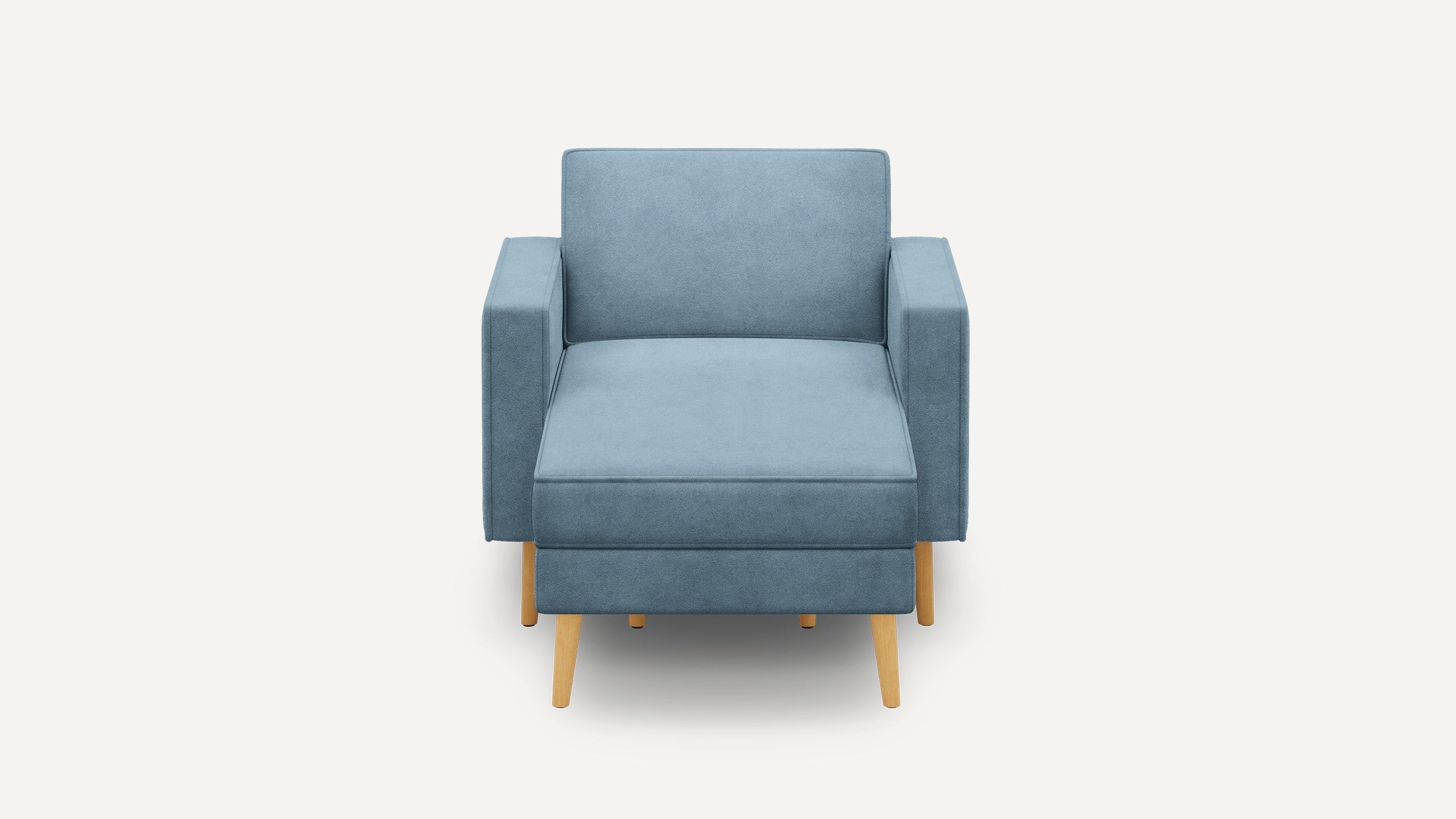 modern light blue upholstered armchair with wooden legs and a soft cushioned seat, isolated against a white background