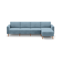 modern light blue fabric sectional sofa with wooden legs and clean lines on the back, featuring a clean, minimalist design
