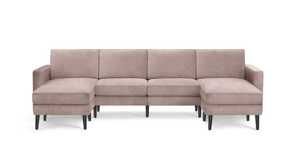 modern light pink velvet sectional sofa with black metal legs and clean lines on the back, featuring a chaise lounge and matching ottoman