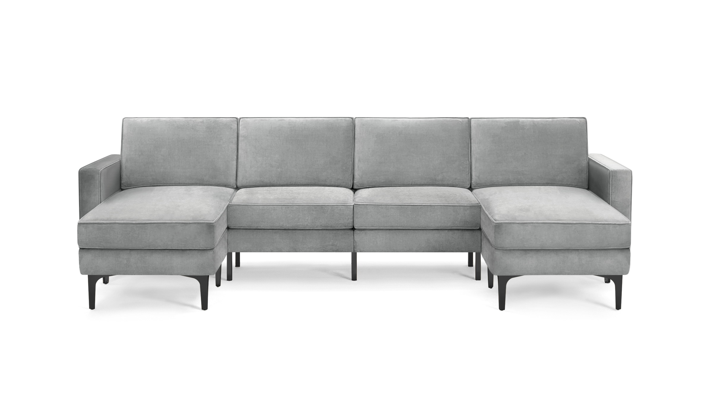 modern light gray velvet sectional sofa with chaise lounge and matching ottoman, featuring sleek black metal legs, on a white background