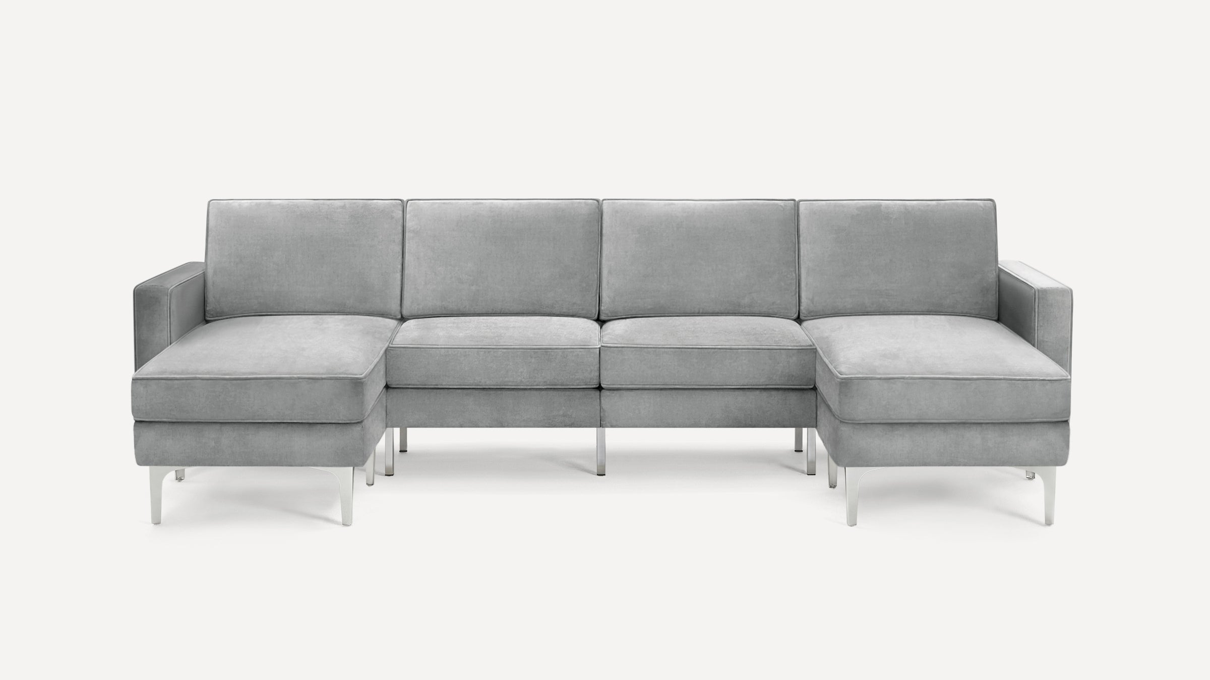 Large modern gray sectional sofa with metal legs, featuring two chaise lounges on each end and cushioned backrests.