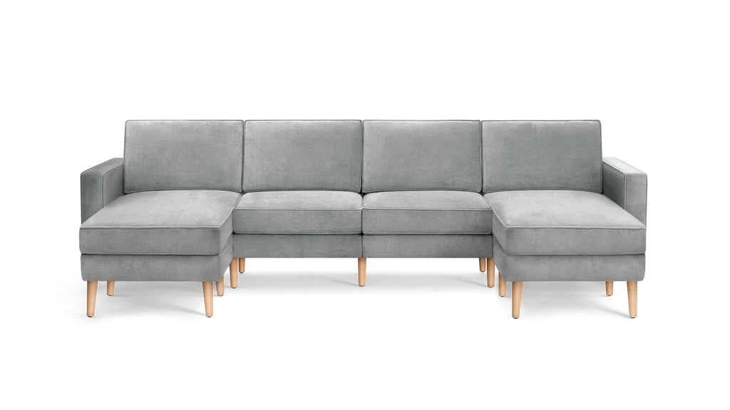 light gray modern sectional sofa with wooden legs and clean lines on the back, featuring clean lines and clean lines on the arms