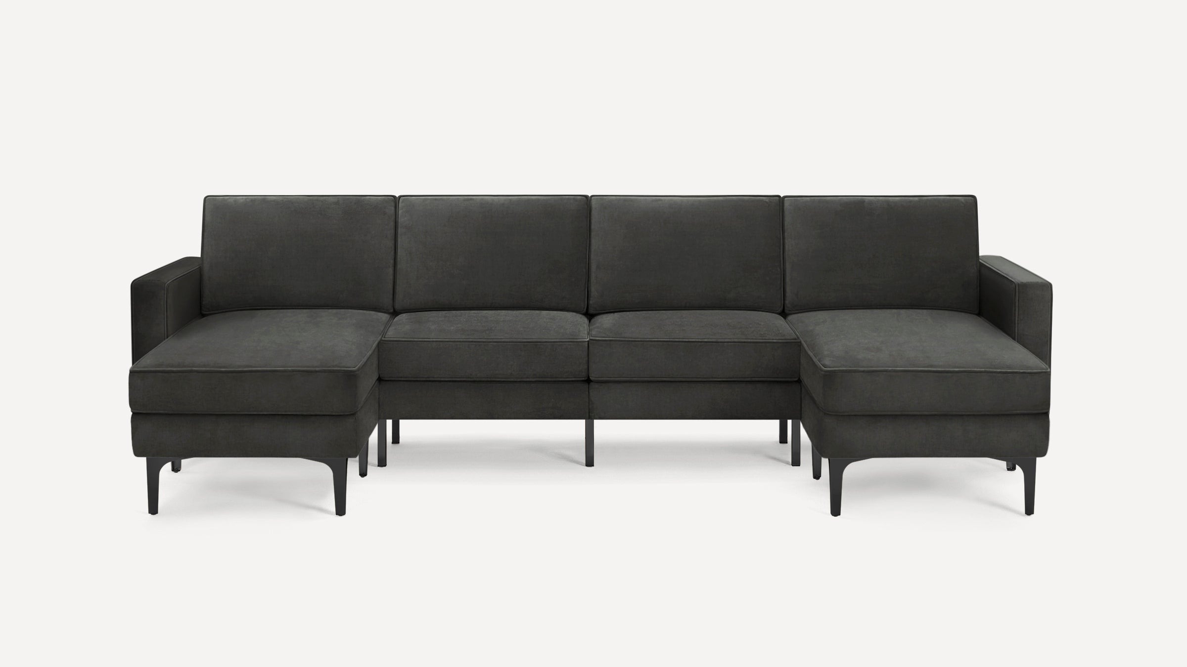 Dark gray modern sectional sofa with left and right chaise lounges, slim black legs, and clean lines, on a white background.