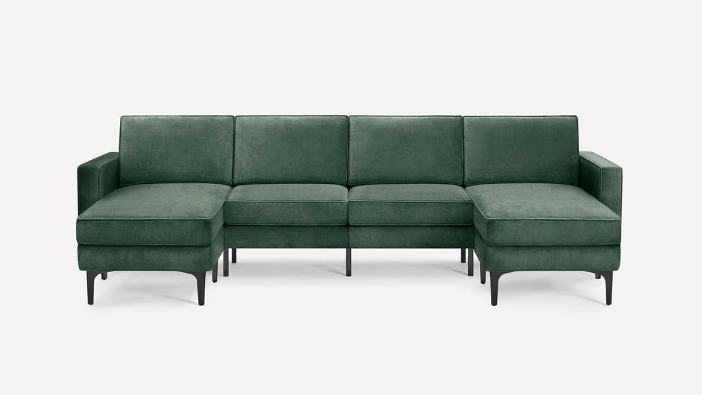 Modern sectional sofa with green velvet upholstery, black metal legs, left and right chaise ends, and clean-lined cushions.