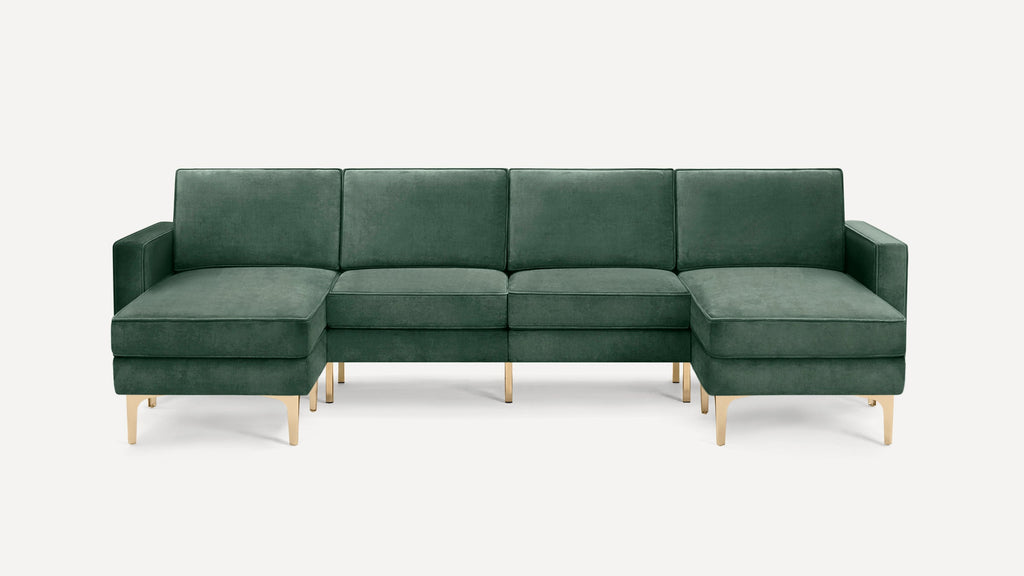 Green velvet sectional sofa with gold metal legs, featuring left and right chaise ends, against a plain white background.