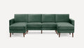 Green velvet sectional sofa with wooden legs, featuring a symmetrical design and cushioned armrests on both ends.