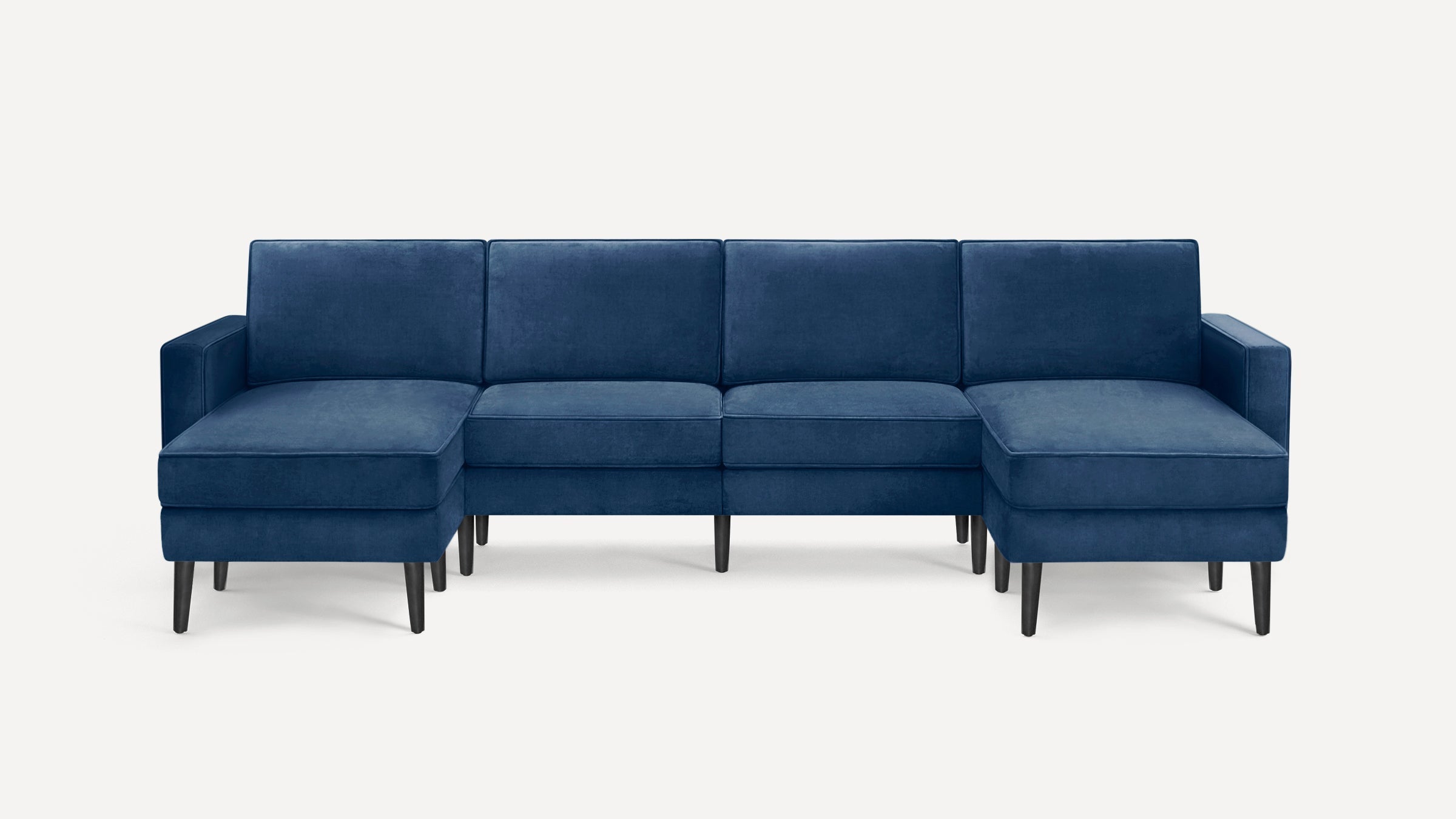 Modern navy blue sectional sofa with a chaise on the left and right sides, featuring clean lines and dark wooden legs.