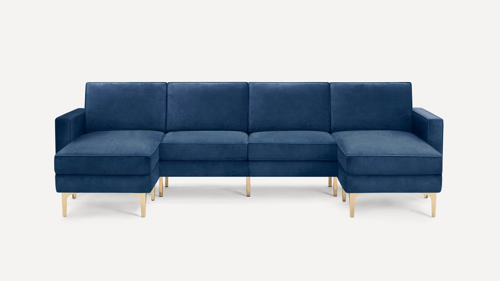 Modern navy blue velvet sectional sofa with gold metal legs, featuring a left-facing chaise and clean, boxy cushions.
