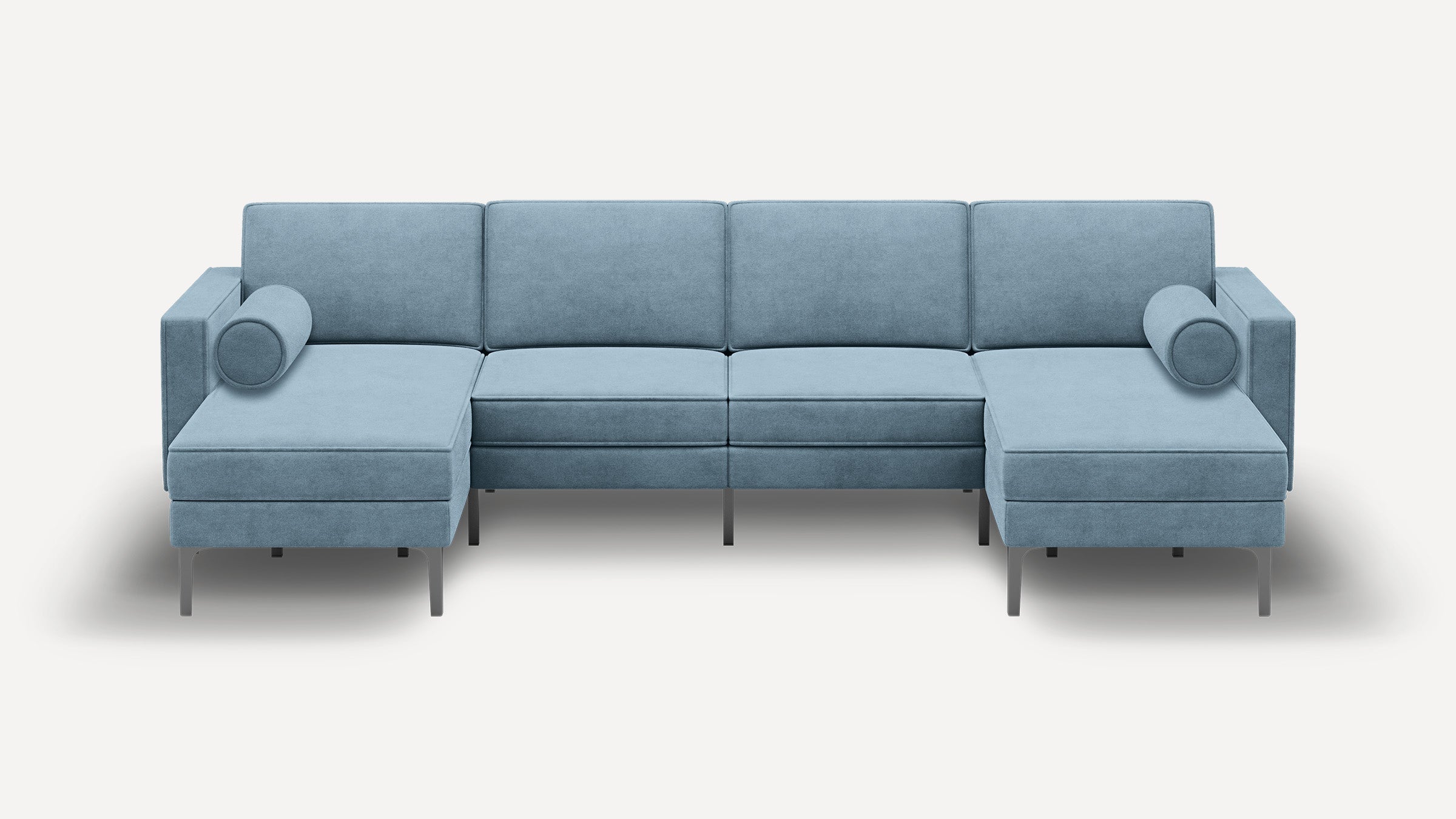 Modern light blue sectional sofa with clean lines, metal legs, two chaise lounges, and cylindrical bolster pillows on each side.