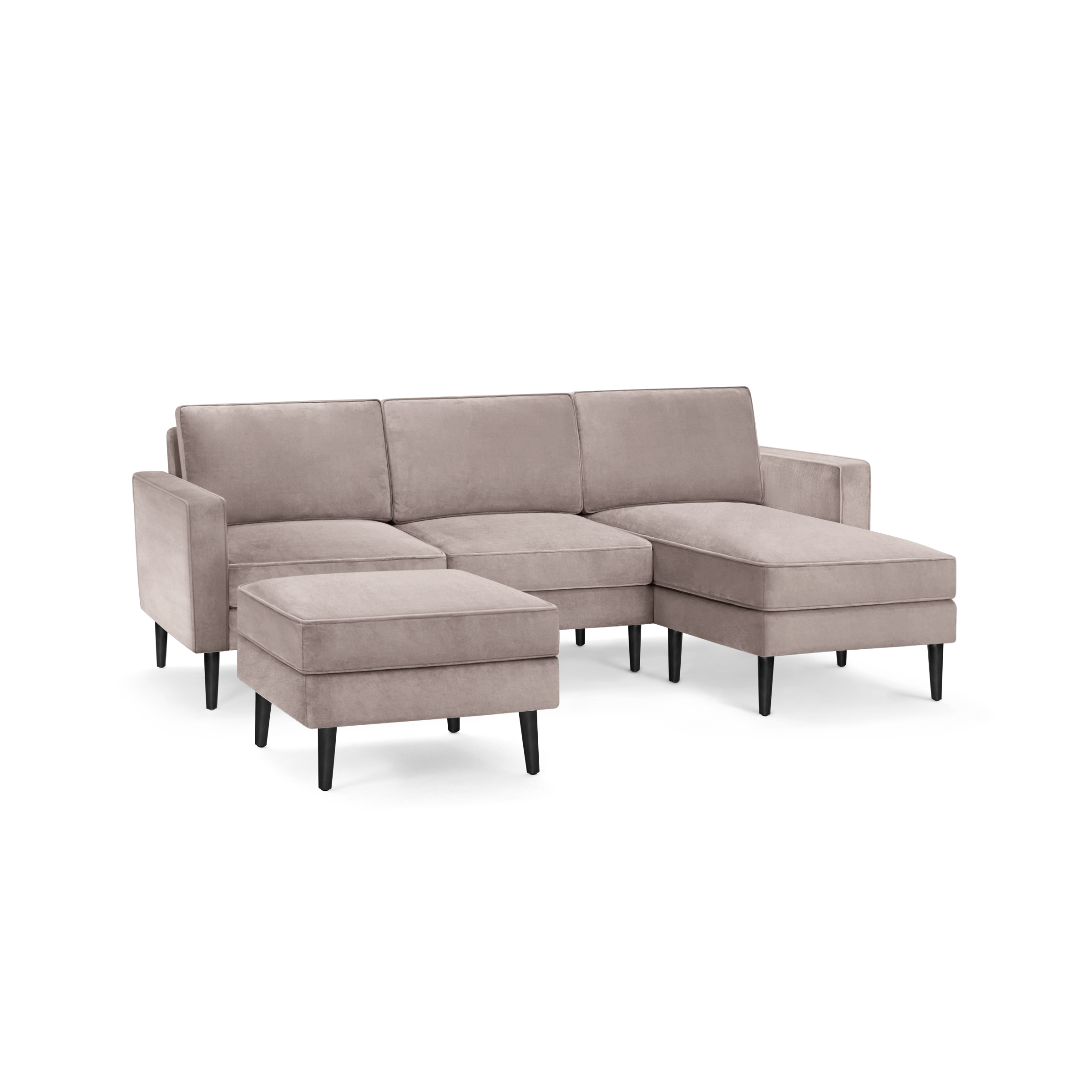 modern l - shaped sectional sofa with sleek black legs and a soft tau colored fabric upholstery, featuring a sleek, modern design