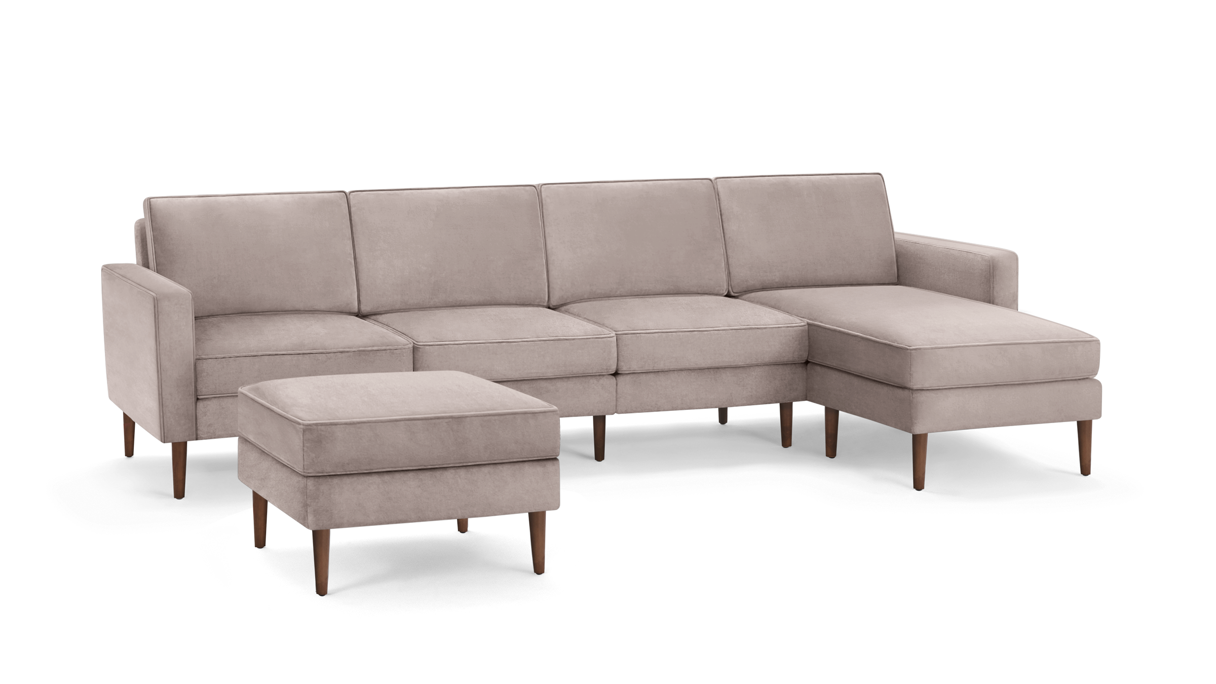 modern light pink sectional sofa with matching ottoman and matching ottoman, featuring wooden legs and clean lines on the back