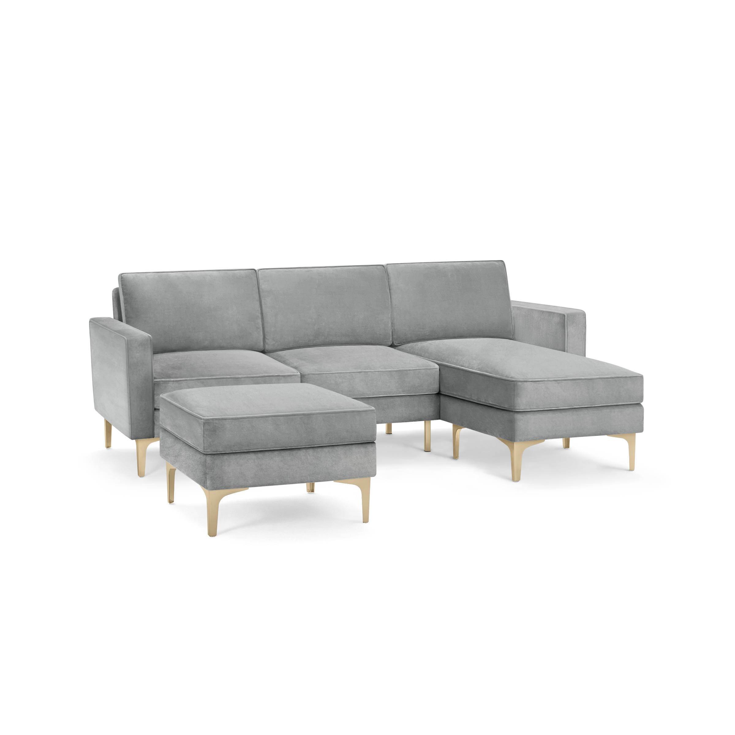 modern light gray sectional sofa with matching ottoman, featuring tapered, tapered legs, and a matching ottoman on the right side